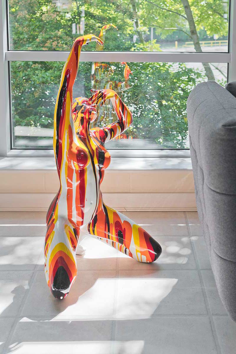 Large Red and Yellow Yoga Lady Sculpture in our Showroom