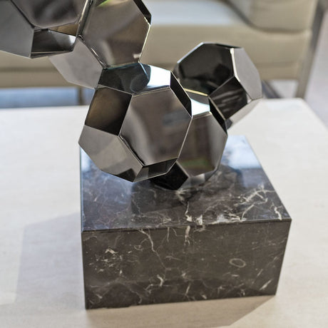 Rhombic Dodecahedron Tower Sculpture on display close up