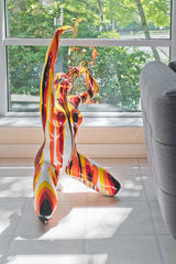 Large Red and Yellow Yoga Lady Sculpture in our Showroom