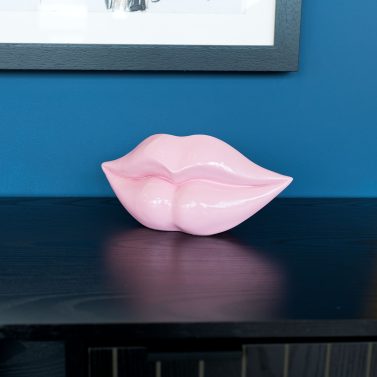 Large Pink Lips Sculpture on Display